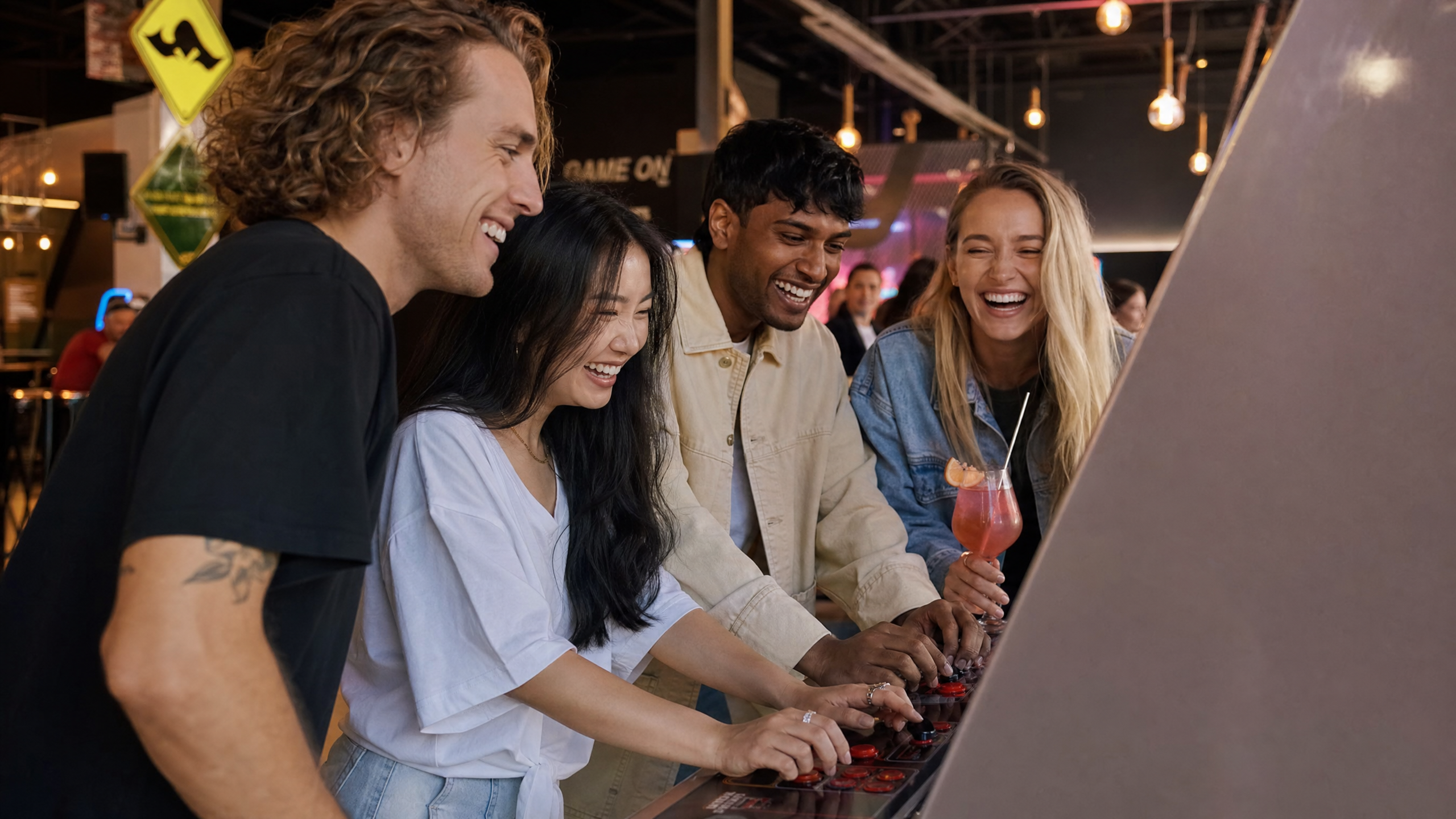 Friends enjoying social games at Nova Arcade